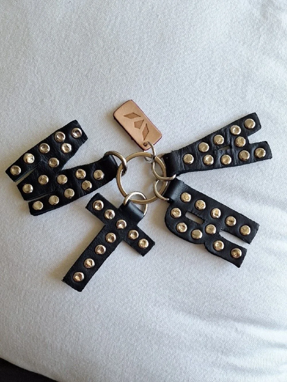 Consuela MTRA Black Studded Letter Bag Charm with Wrist Strap